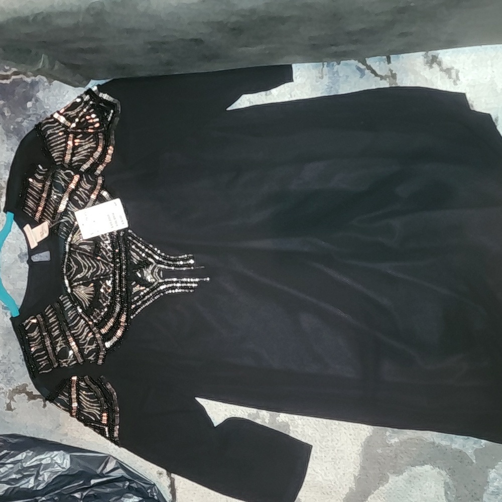 Black size 8 sheath intricate beaded dress. In prestine condition. NWT